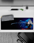 32x12 inches anime desk mat in midnight gradients, neon blues, and orange ribbon accents for a moody vibe.