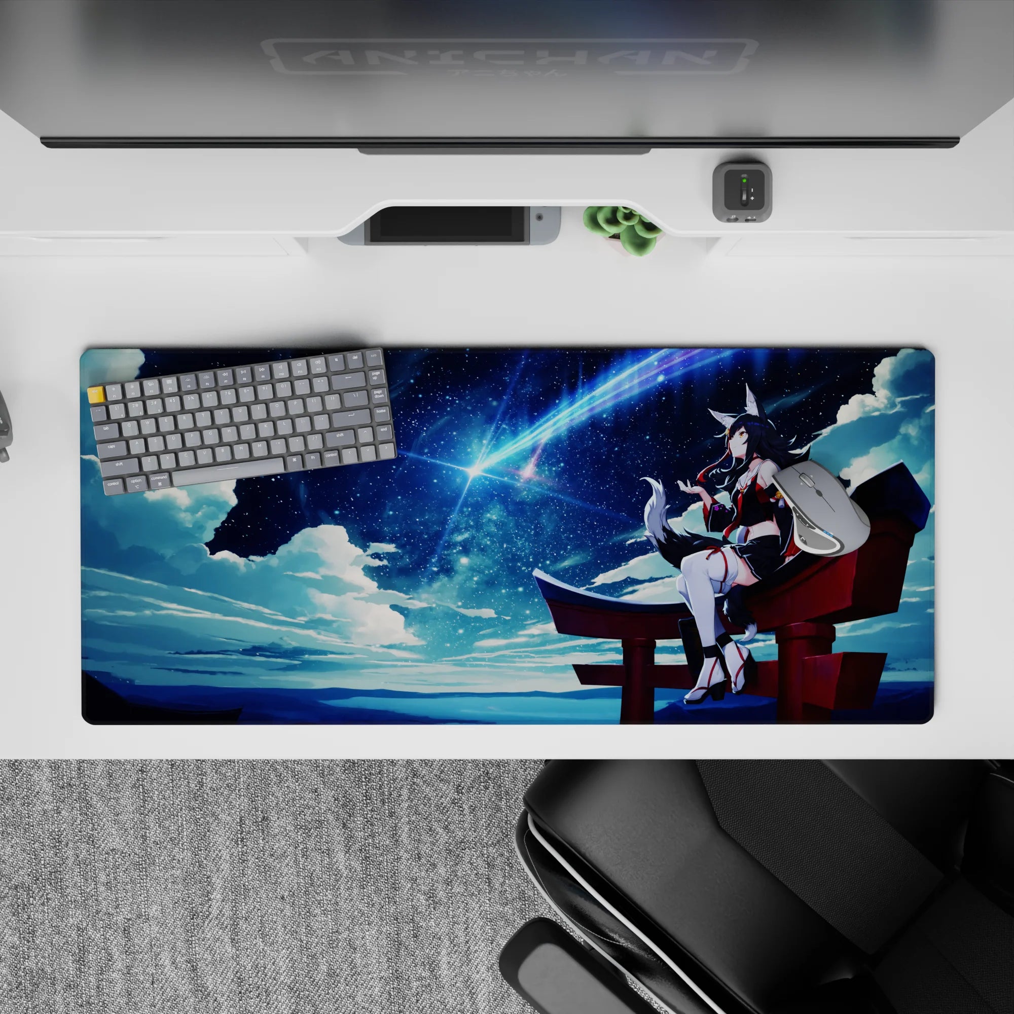 36x16 inches desk pad in deep navy with comet-blue streaks, soft clouds, and cozy midnight glow.