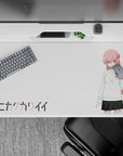 Cozy moody pink-haired anime desk pad 40x20 inches on white background, cute sweater and dark skirt.