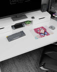 Flustered pink-haired anime girl in chunky navy headphones, crisp desk art mouse pad 14x10 inches.