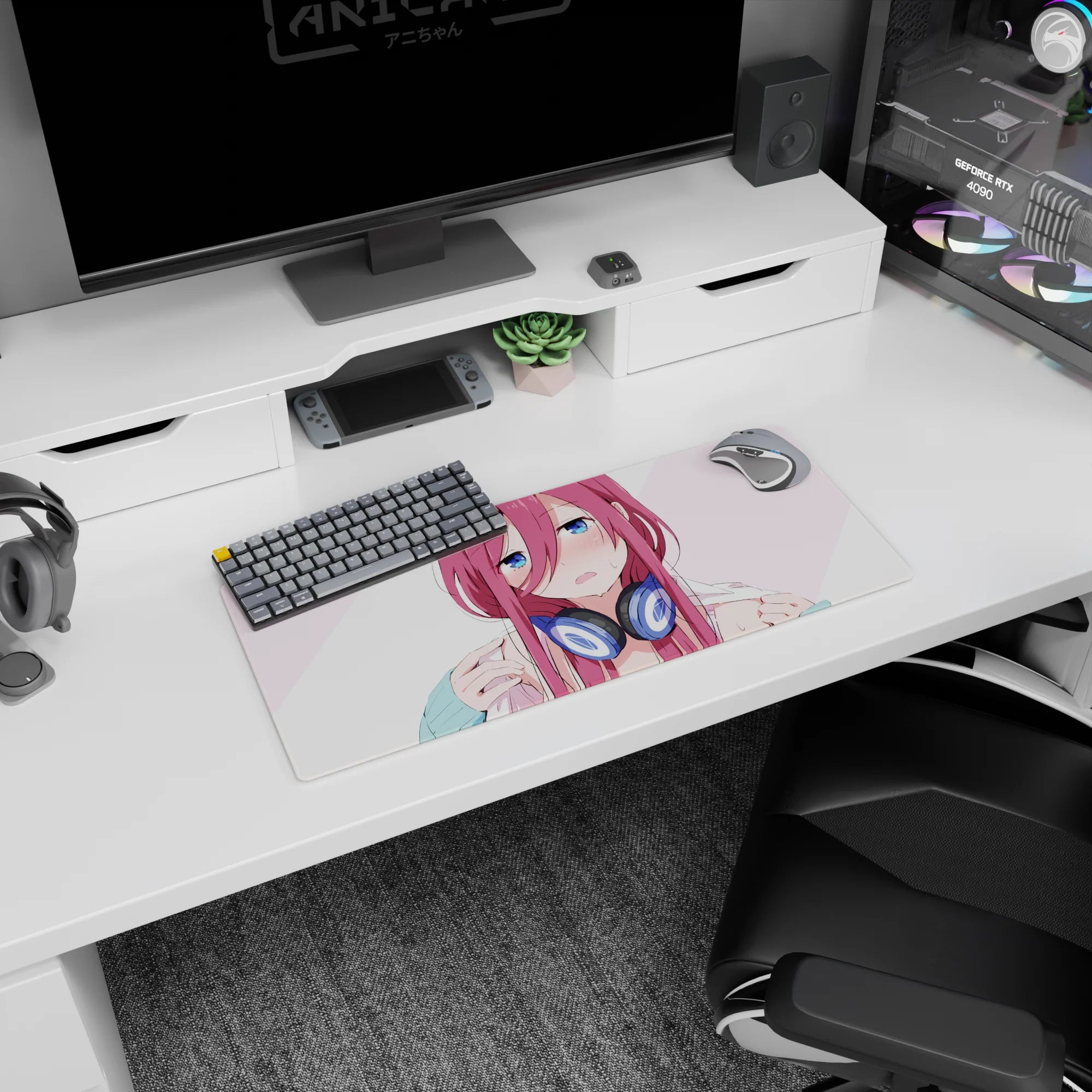 Flustered pink-haired anime girl in chunky navy headphones on a 28x12 inches mouse pad, like she paused music.