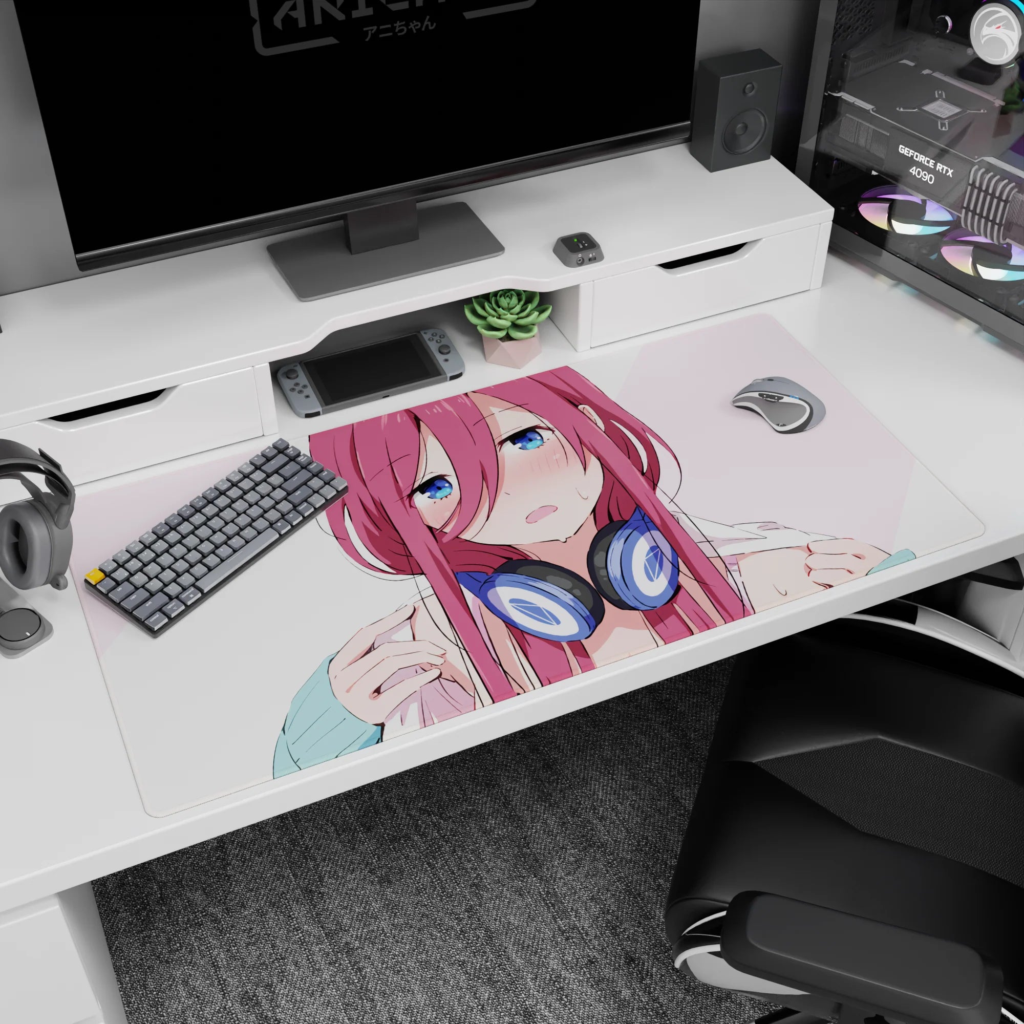 Flustered pink-haired anime girl in navy headphones on a 40x20 inches desk pad, staring with big blue eyes.