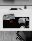 28x12 inches anime mouse pad in smoky blacks and deep greens with a red Sharingan glow, chill vibe.