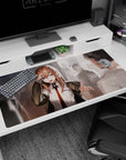 Playful anime schoolgirl desk pad 40x20 inches in white shirt, orange tie, jacket slipping off shoulders.