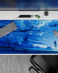 40x20 inches anime desk pad in icy blues with dreamy clouds, soft sparkles, and calming ocean horizon.
