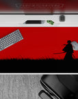 40x20 inches anime desk pad in stark black and red, calm-before-the-strike vibe with minimalist contrast.