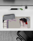 Soft spring anime mouse pad 28x12 inches in warm gray, lilac petals, calm cozy vibe with red ribbon accents.