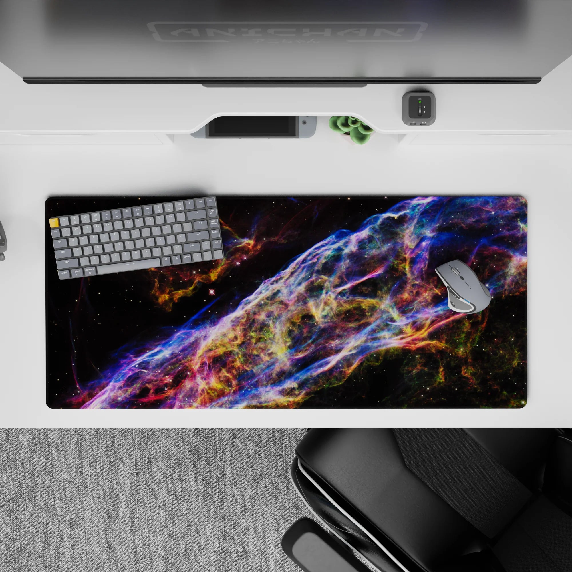 Neon blue, violet, and ember-orange space desk pad 36x16 inches for a vibrant late-night gaming vibe.