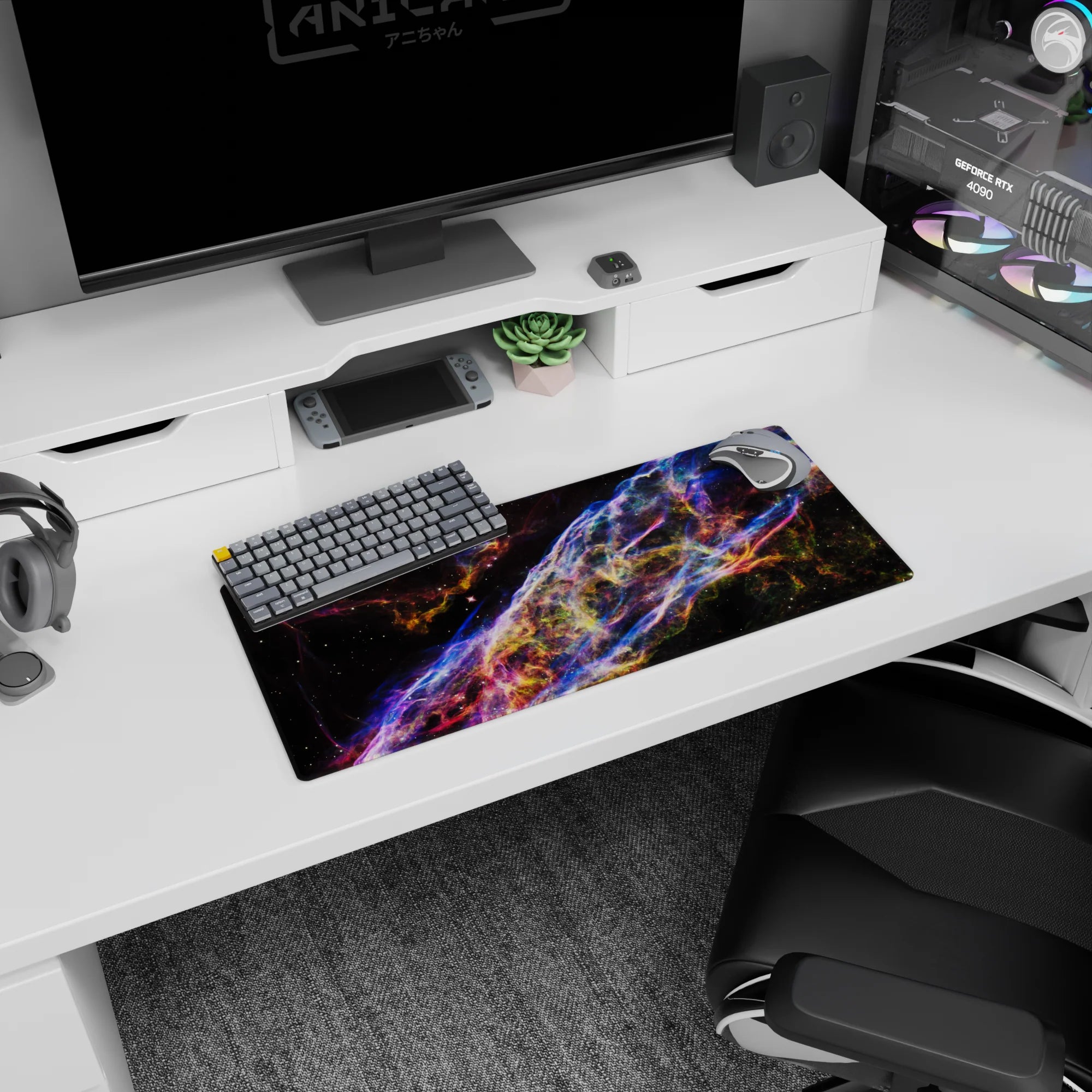 Deep space scene mouse pad 28x12 inches featuring a swirling cosmic ribbon and scattered tiny stars.