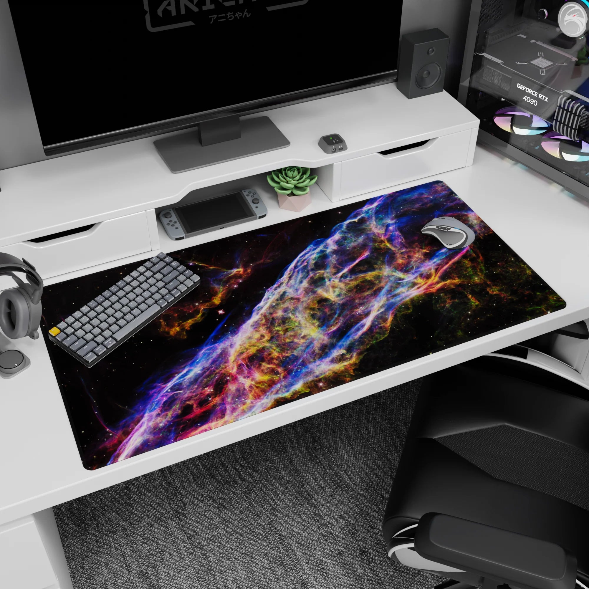 Deep space scene desk pad with neon ribbon swirls and tiny stars scattered throughout, 40x20 inches.