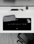 Matte black Naruto anime mouse pad with bright white linework, minimalist stealth vibe, 28x12 inches.