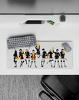 Dramatic black-and-orange volleyball anime mouse pad 28x12 inches, crisp ink lines on white background.
