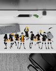 Dramatic black-and-orange volleyball desk pad 36x16 inches on clean white background, bold and tidy.