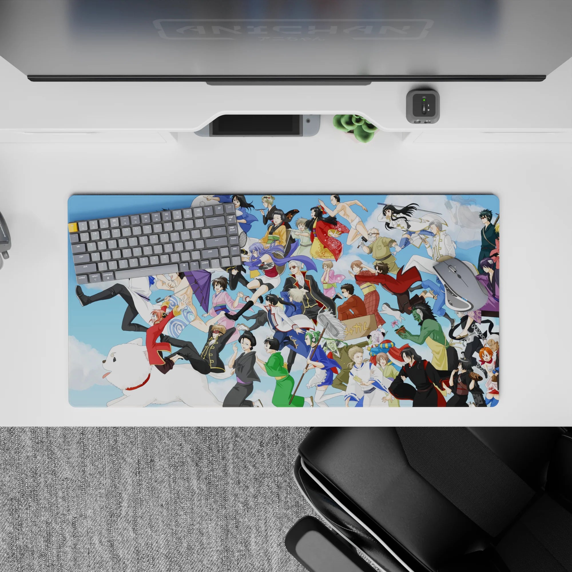 Bright blue Gintama desk pad 32x16 inches with playful chaos, soft clouds, and colorful costumes.