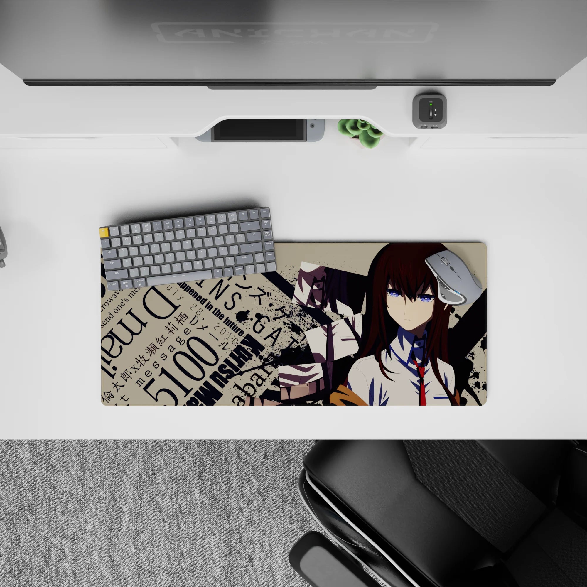 Auburn hair, blue eyes, beige backdrop, and black splatter chaos on an anime mouse pad 28x12 inches.