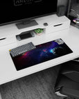 Two planets in a starry nebula scene on a 28x12 inches mouse pad, cool blue glow and shadowy warmth.