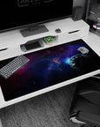 Planet and starlit nebula scene desk pad 40x20 inches featuring a cool blue glow and a shadowy planet.