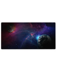 Deep-space galaxy desk mouse pad 32x16 inches with planets, star specks, and soft nebula clouds.