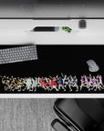 Vibrant orange, teal, red, blue, and purple volleyball anime desk pad 36x16 inches on deep black.