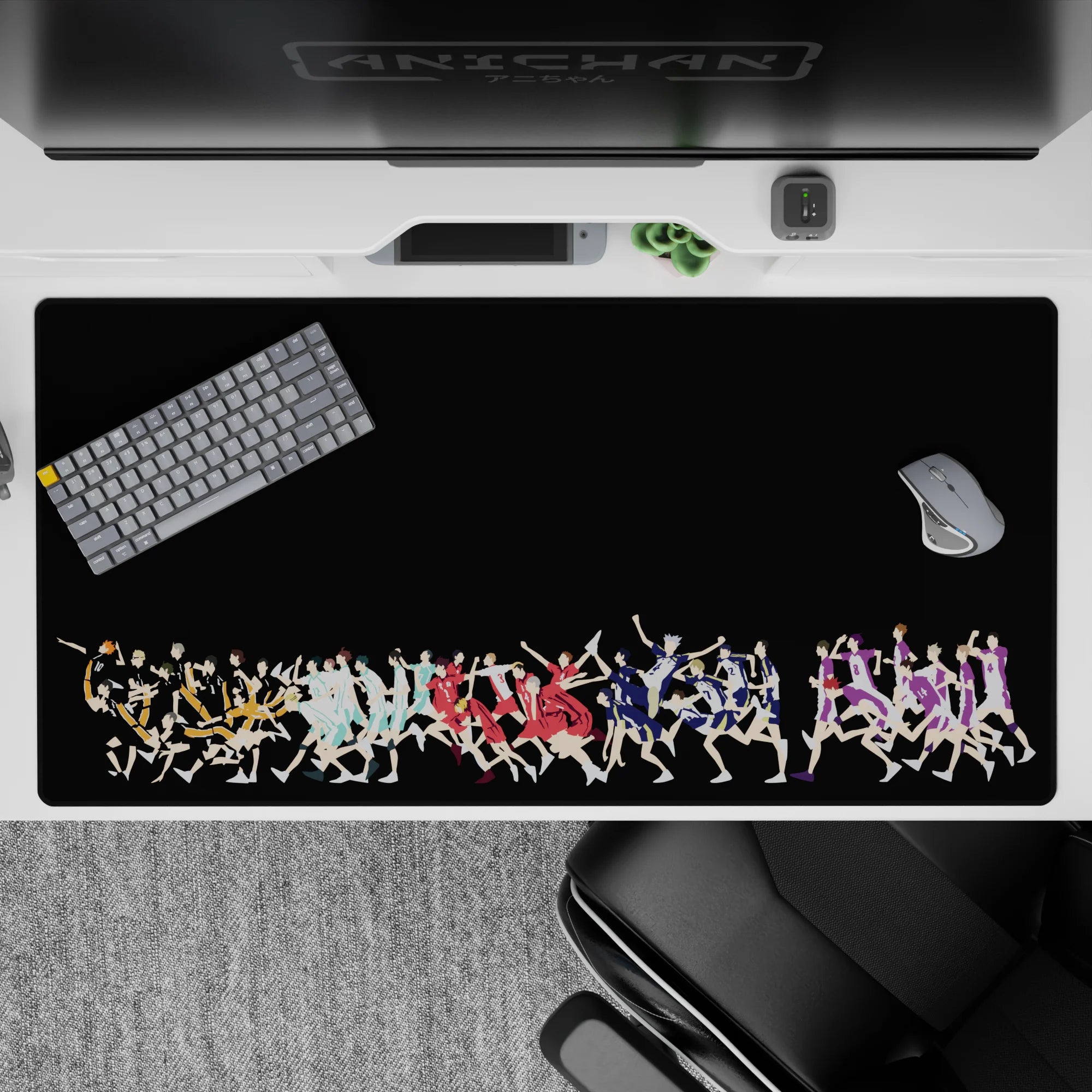 Vibrant orange, teal, red, blue and purple volleyball anime desk pad on black, 40x20 inches.