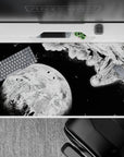40x20 inches anime desk pad in stark black and white, bold contrast with a quiet, brave deep-space mood.