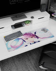 32x12 inches mouse pad featuring a pouty anime idol girl with pink twin-tails, teal bows, and shimmer.