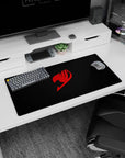 Red guild crest stamp centered on charcoal anime mouse pad 32x16 inches, crisp edges for gaming.