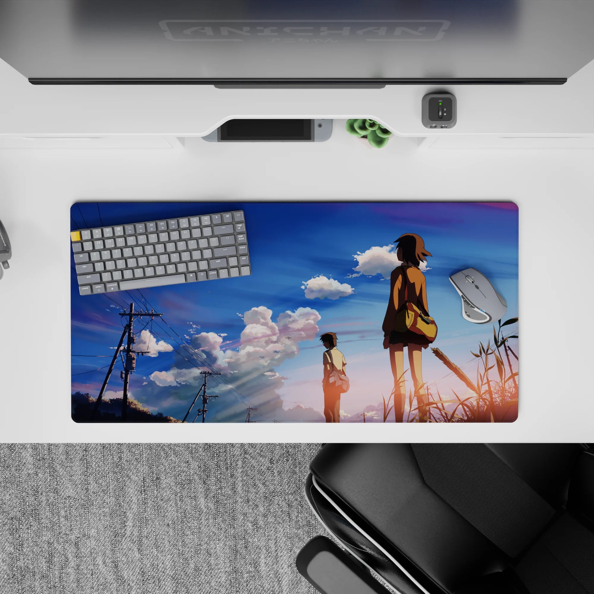32x16 inches anime desk pad in calm golden hour hues, blue sky gradient with pink-lavender clouds.