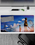 32x16 inches anime desk pad in calm golden hour hues, blue sky gradient with pink-lavender clouds.