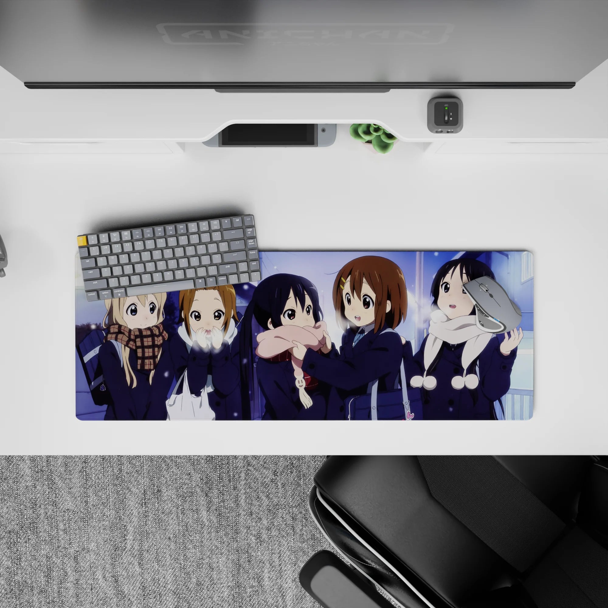 Cozy snowy night anime girl mouse pad 32x12 inches in soft blue and violet glow with warm scarf accents.
