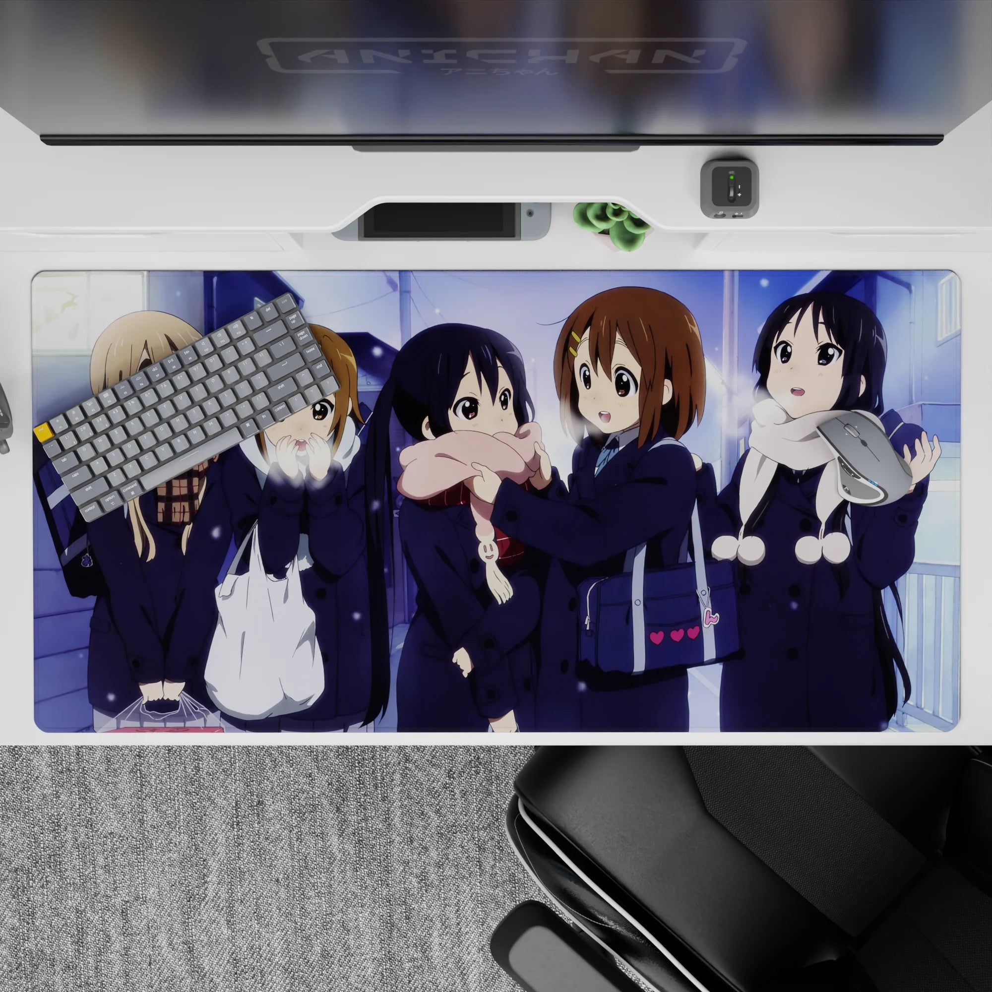 Cozy snowy night anime girl desk pad 40x20 inches, soft blues and violet glow with cream and pink scarves.