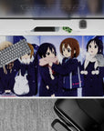 Cozy snowy night anime girl desk pad 40x20 inches, soft blues and violet glow with cream and pink scarves.