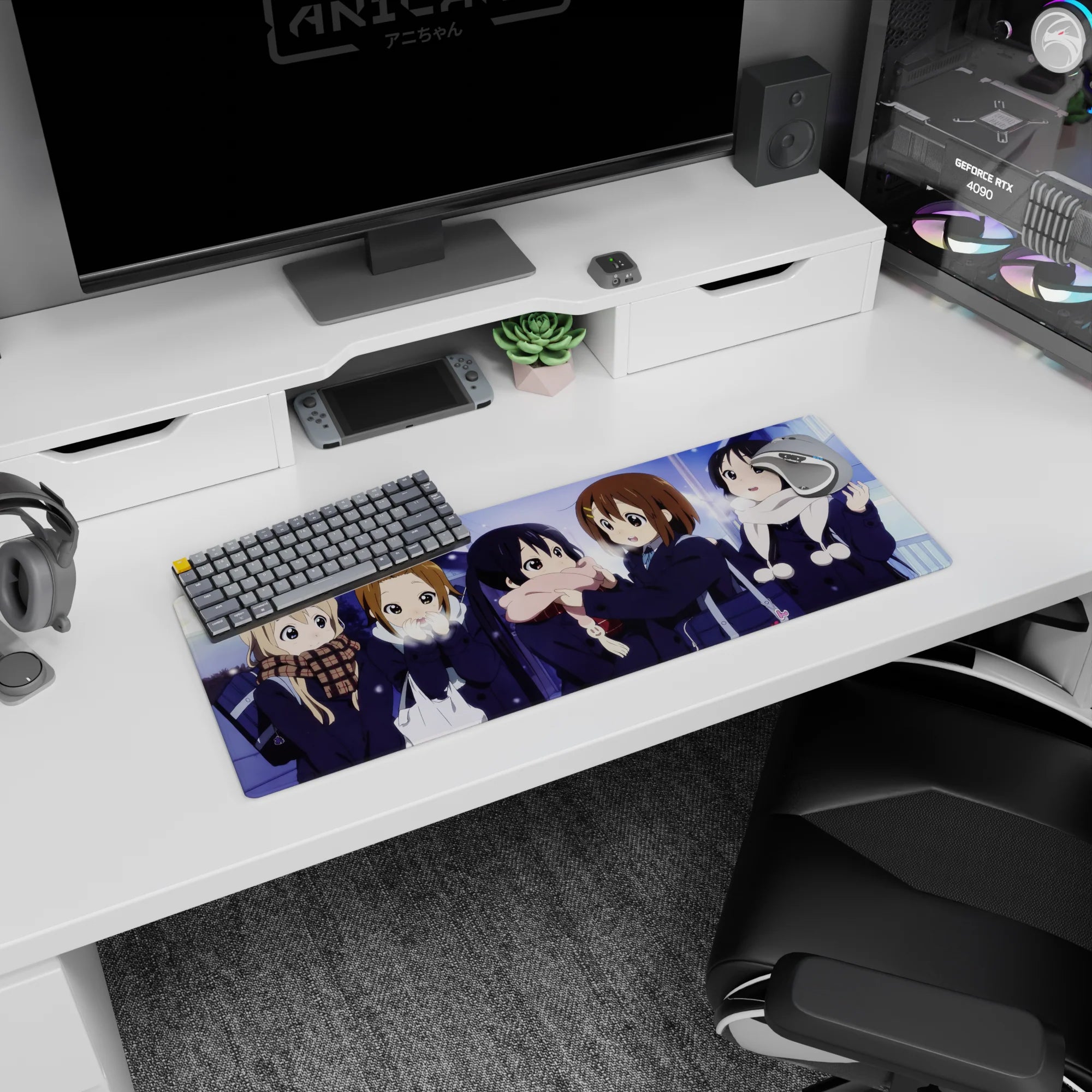 Yui Hirasawa and friends giggling in dark coats, heart bag detail anime girl mouse pad 32x12 inches.