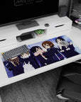 Yui and friends giggling under streetlights on a 36x16 inches anime girl desk pad, heart bag detail.