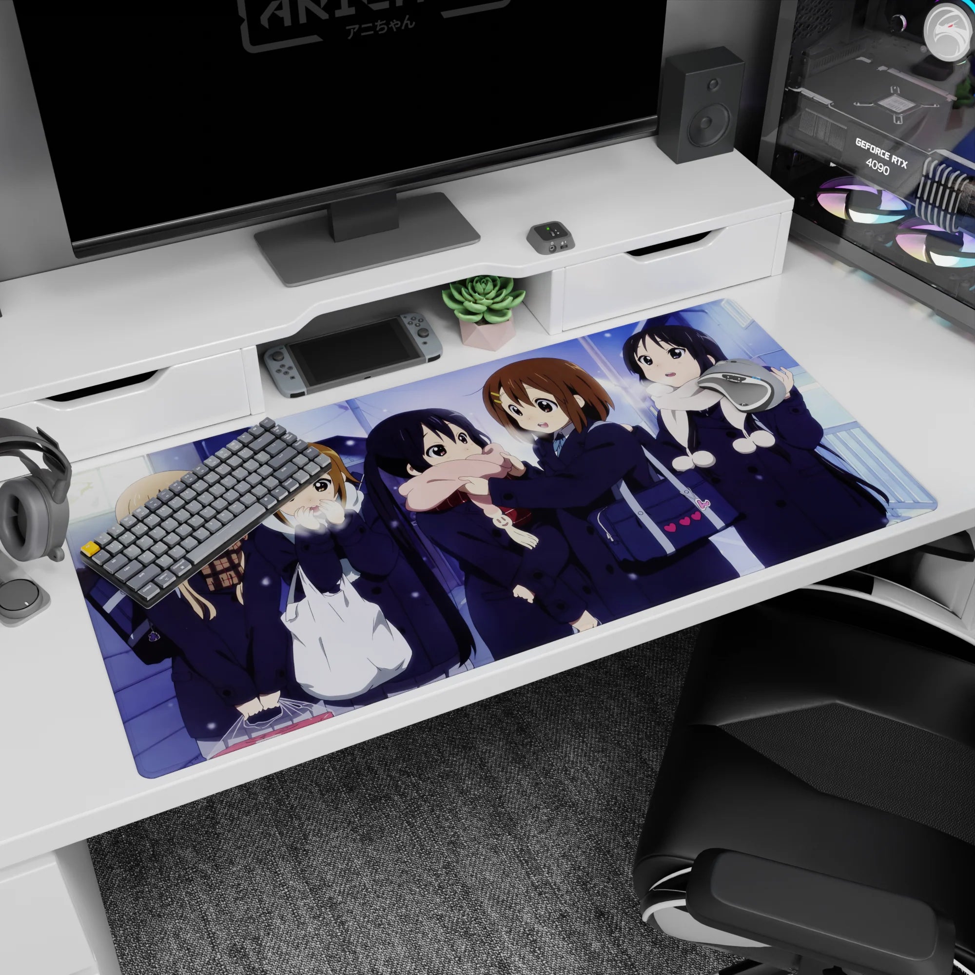 Yui Hirasawa and friends giggling on a snowy walk anime girl desk pad 40x20 inches, heart bag detail.