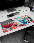 Karen Araragi winking with Shinobu Oshino popping in on anime desk pad 36x16 inches.
