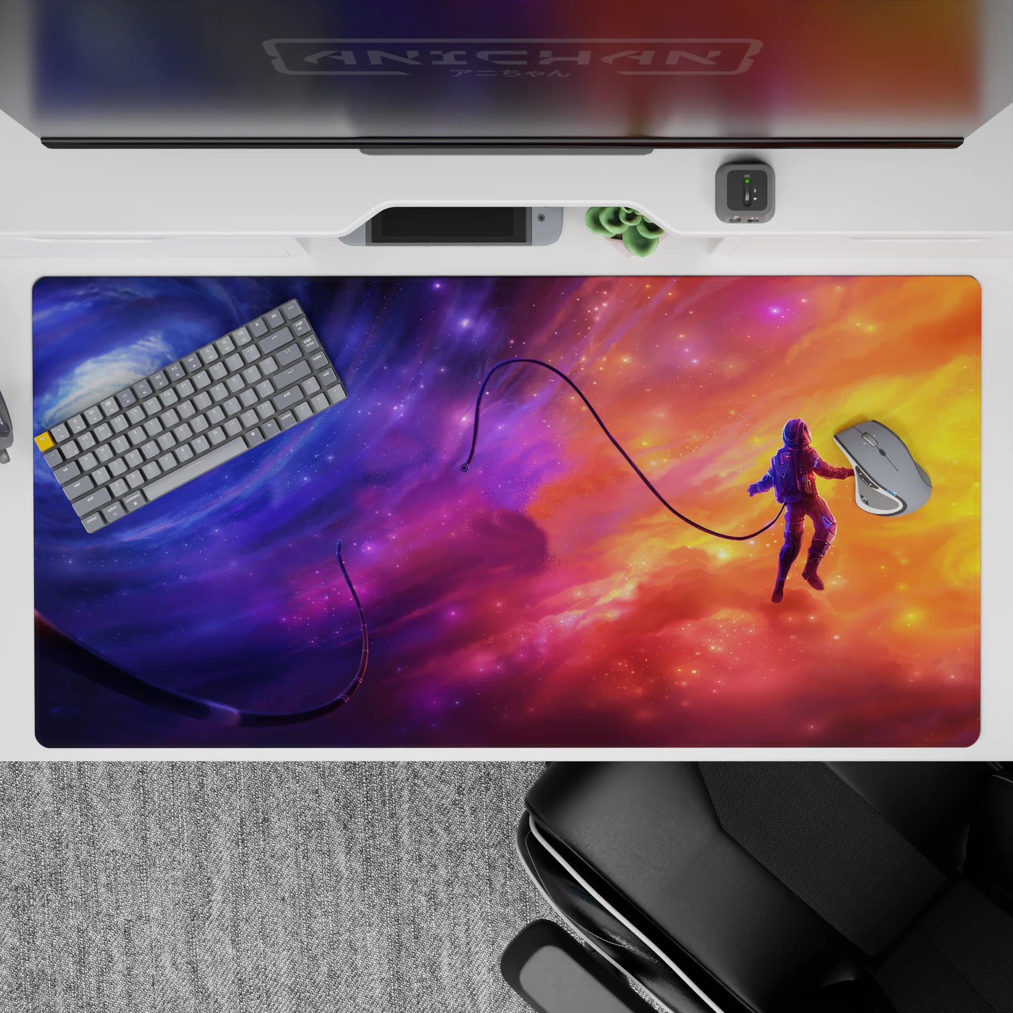 Dreamy 40x20 inches desk pad in violet and glowing tangerine over deep blues, soft surreal space vibe.