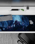 Moody 36x16 inches anime desk pad in cold blue spotlight glow, deep shadows, drifting spark snow.