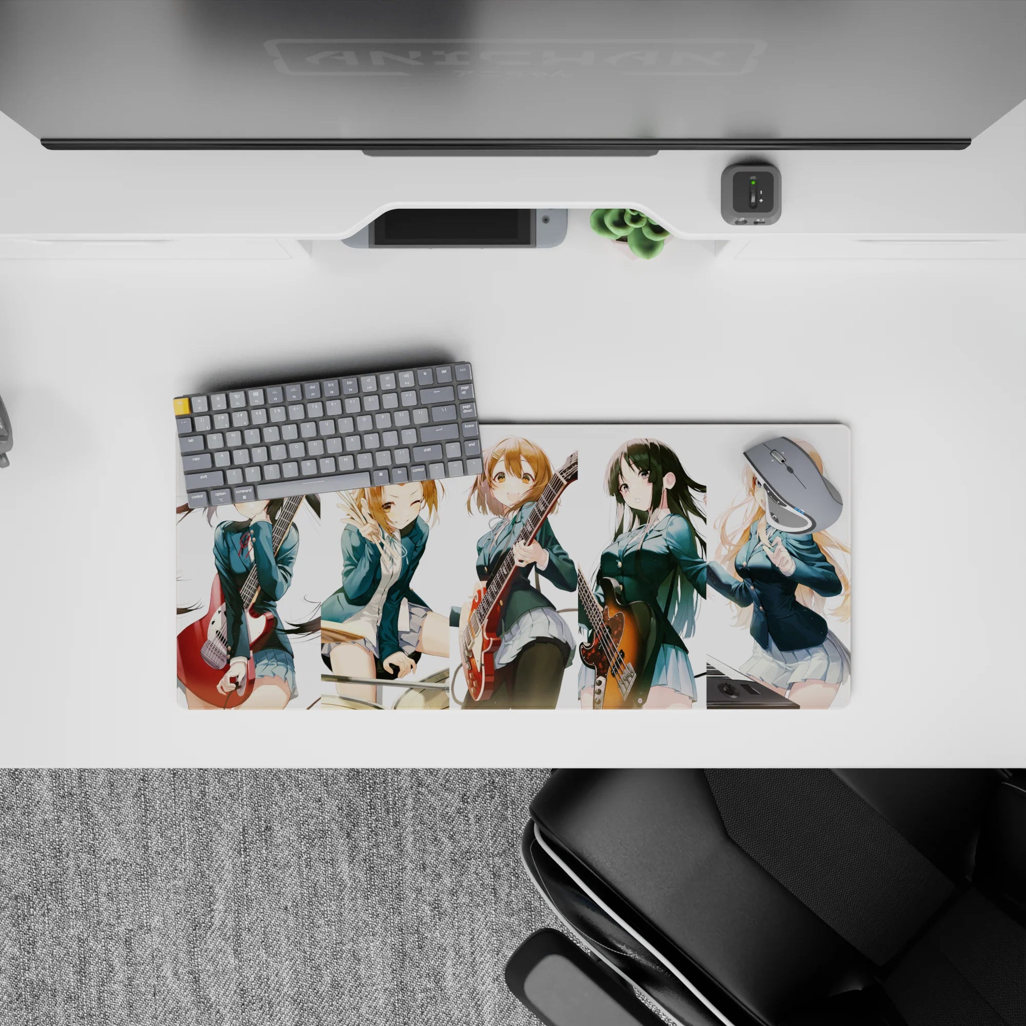 Cheerful teal blazers and warm guitar reds on a cozy anime girl mouse pad, 28x12 inches.