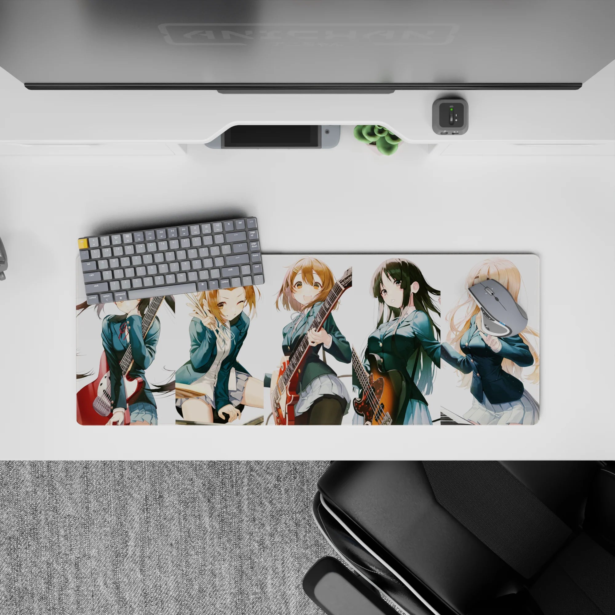 Cheerful teal blazer anime girl mouse pad 32x12 inches with warm guitar reds and cozy chaotic energy.