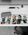 Cheerful teal blazer anime girl mouse pad 32x12 inches with warm guitar reds and cozy chaotic energy.