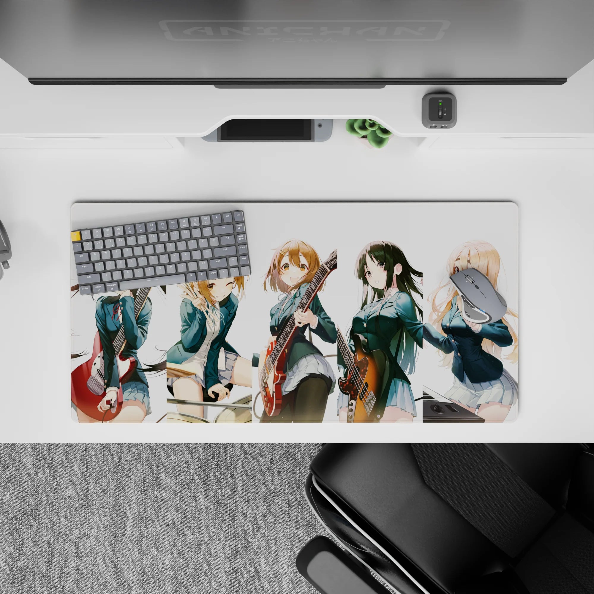 Cheerful teal blazer anime girl mouse pad 32x16 inches with warm guitar reds and cozy chaotic vibes.
