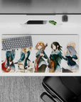 Cheerful teal blazer anime girl mouse pad 32x16 inches with warm guitar reds and cozy chaotic vibes.