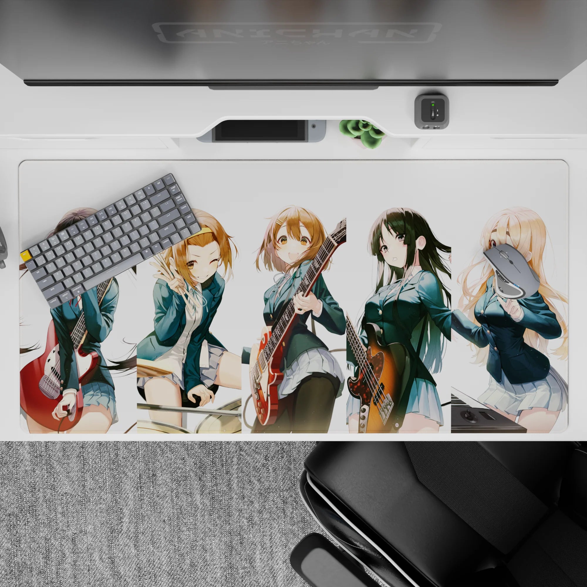 Cheerful teal-and-white anime desk pad 40x20 inches with warm guitar reds and cozy chaotic vibes.