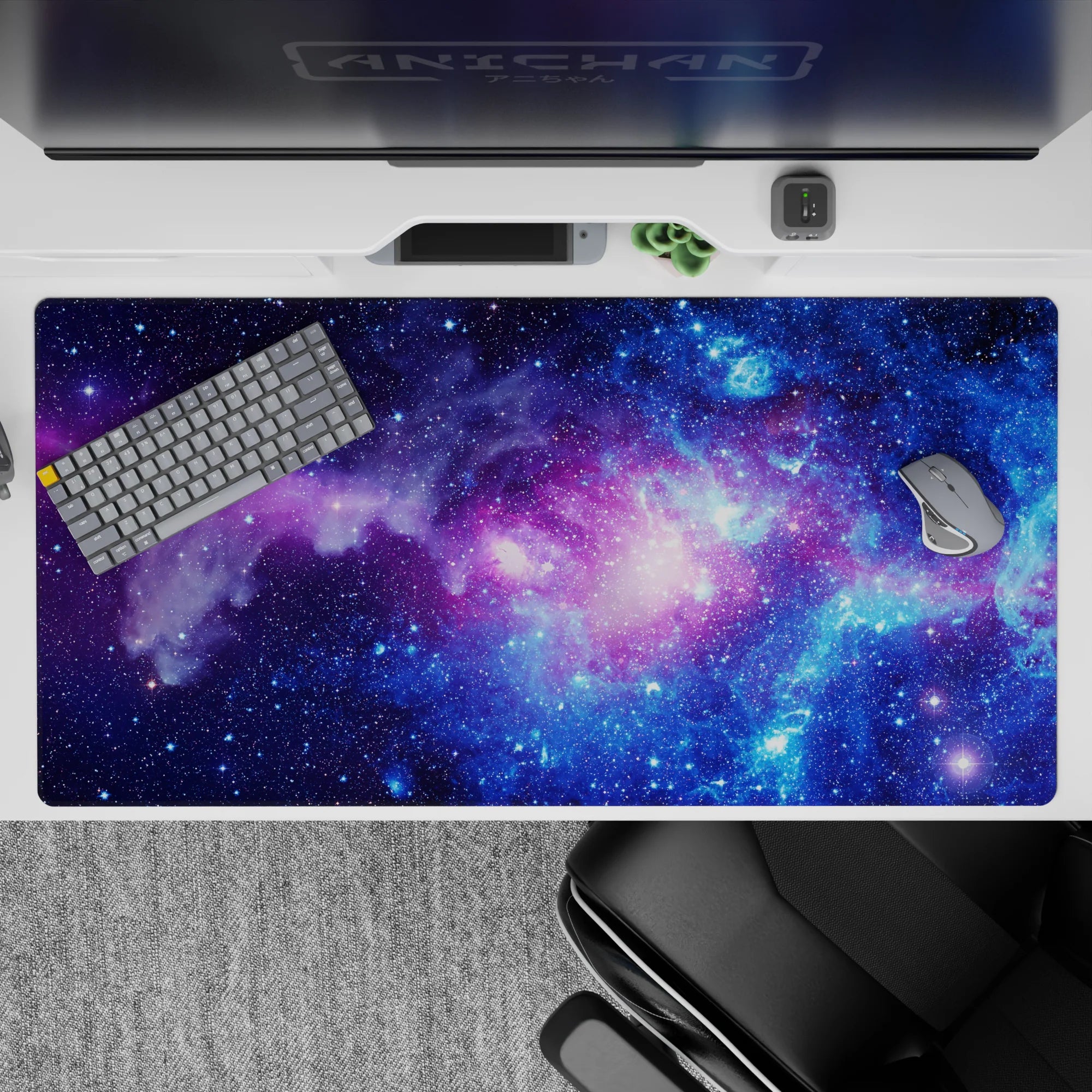 Midnight blue and electric purple 40x20 inches desk pad with calming pink glow for late-night focus.