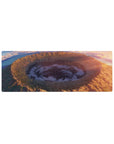32x12 inches anime mouse pad with vast crater landscape, golden cliffs, wildflowers, and spiral storm clouds.