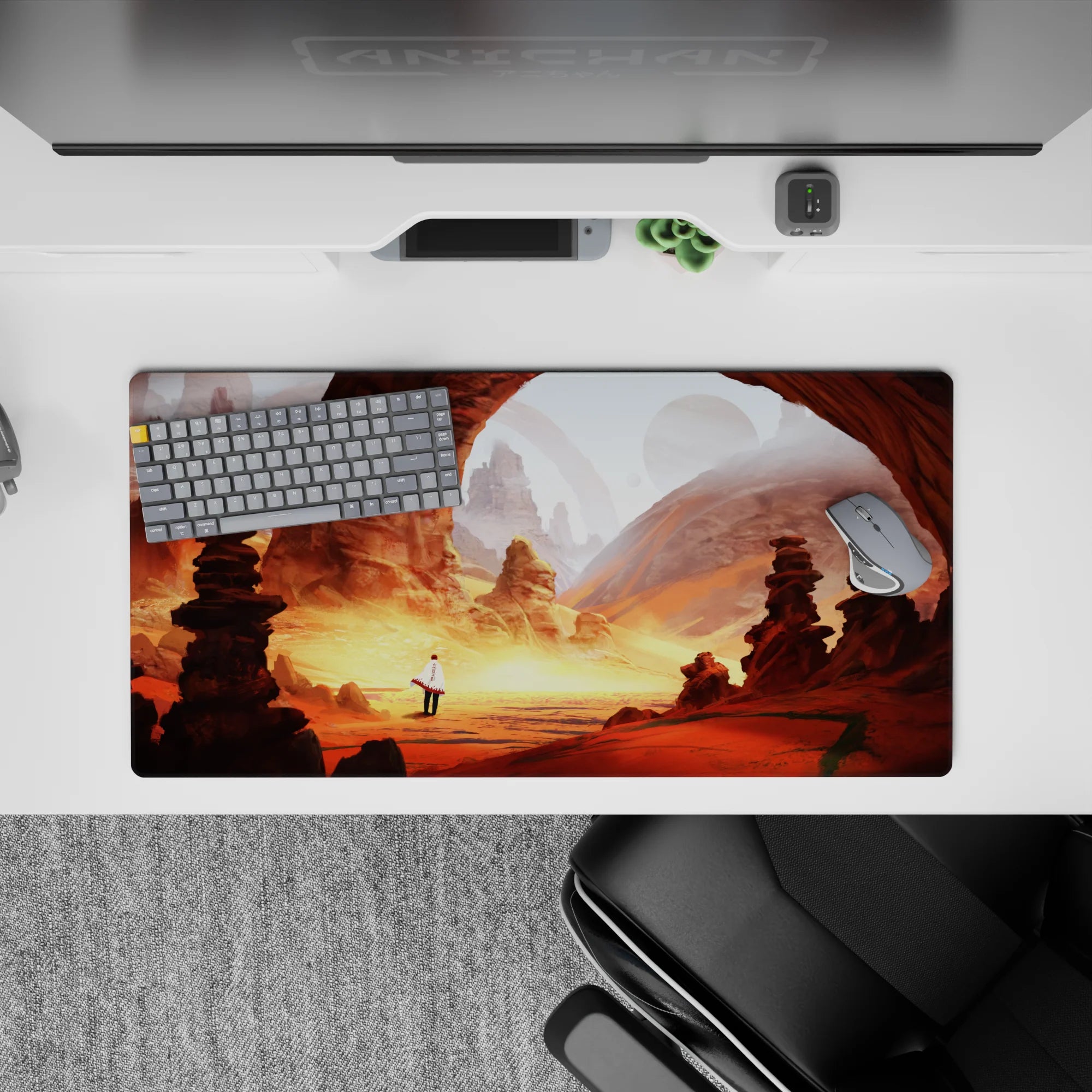 32x16 inches anime mouse pad in warm orange and dusty gold, dreamy desert glow with soft planets overhead.