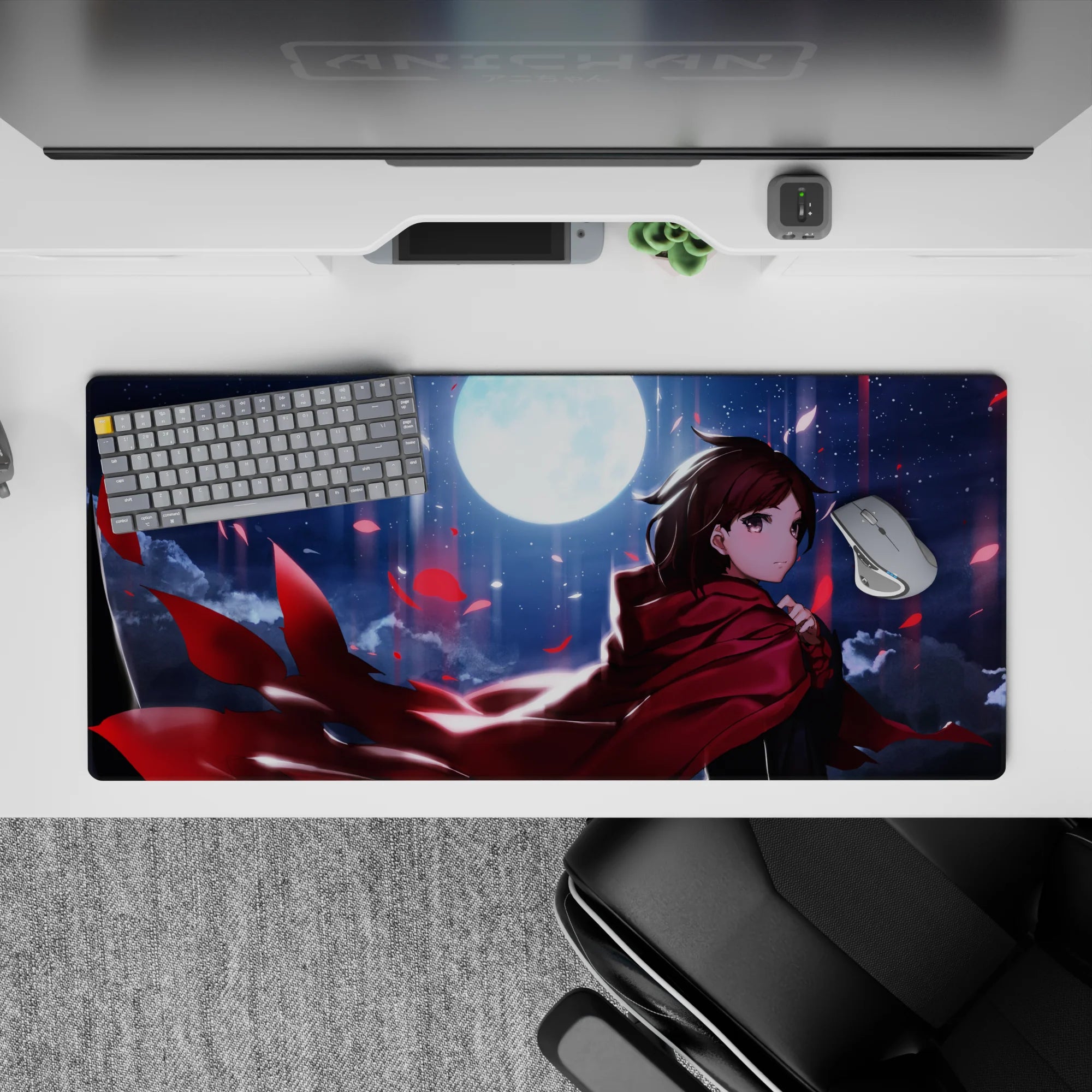 Moody 36x16 inches anime desk pad in deep blues and inky clouds, vivid crimson petals, glossy shine.