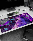 Dark-haired boy hugs tearful girl under petals and crescent moon on anime desk pad 40x20 inches.