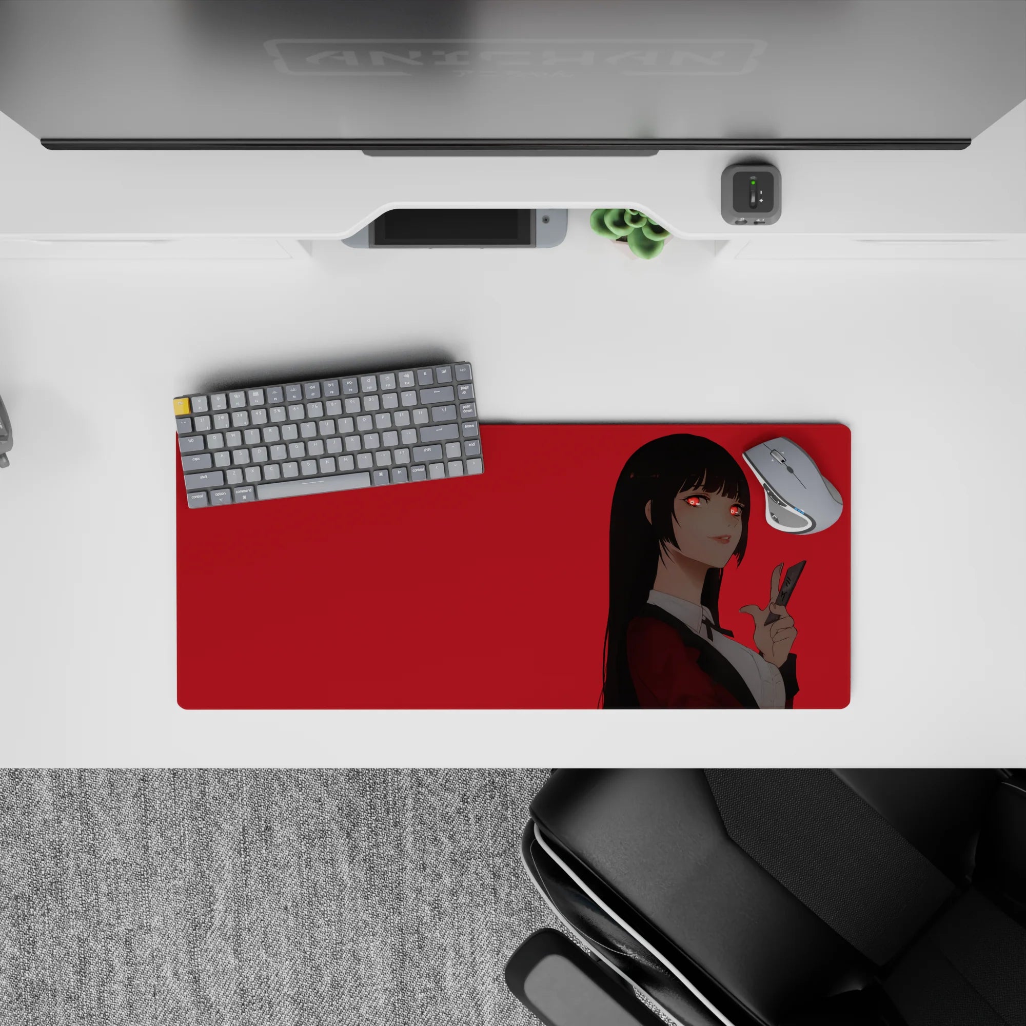 28x12 inches extended mouse pad in bold red and black, glowing red eyes and daring smile, sleek minimalist vibe.